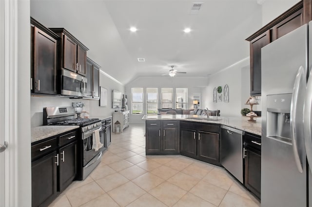 4609 Autumn Morning Dr, Spring, TX 77386 - kitchen featuring appliances with stainless steel finishes, ceiling fan, a sink, a peninsula, and open floor plan