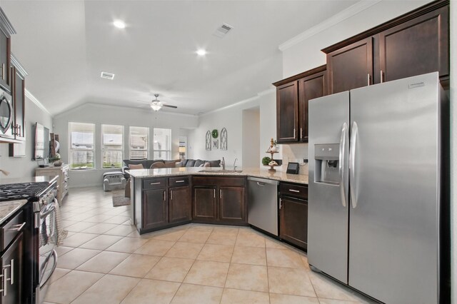 4609 Autumn Morning Dr, Spring, TX 77386 - kitchen with appliances with stainless steel finishes, ornamental molding, a sink, a ceiling fan, and open floor plan