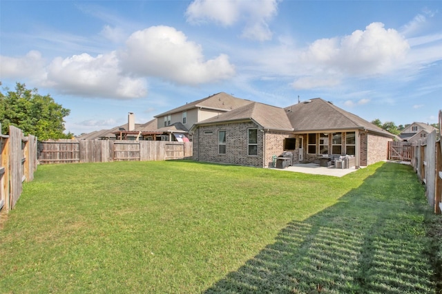 4609 Autumn Morning Dr, Spring, TX 77386 - rear view of property featuring brick siding and a patio
