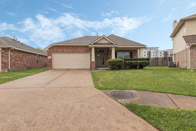 5206 Fairtide Dr, Baytown, TX 77521 - view of front facade with cooling unit, brick siding, a garage, driveway, and roof with shingles