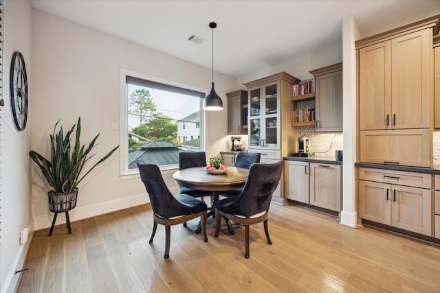 4019 Drummond St, Houston, TX 77025 - dining area with light wood-style floors and baseboards