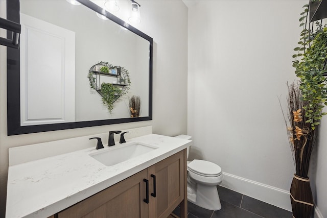 4019 Drummond St, Houston, TX 77025 - half bathroom featuring vanity, toilet, tile patterned flooring, and baseboards