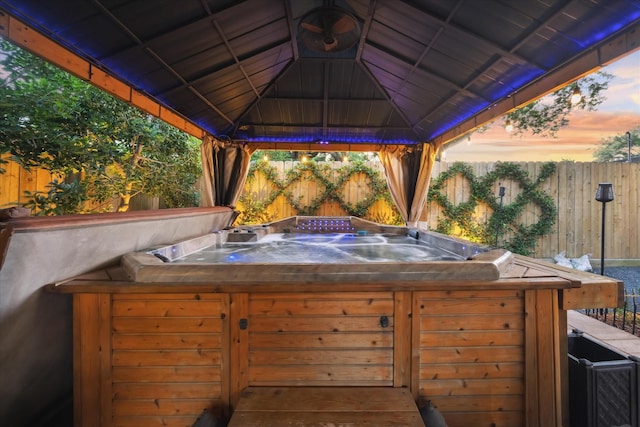 4019 Drummond St, Houston, TX 77025 - deck at dusk featuring a gazebo and a hot tub