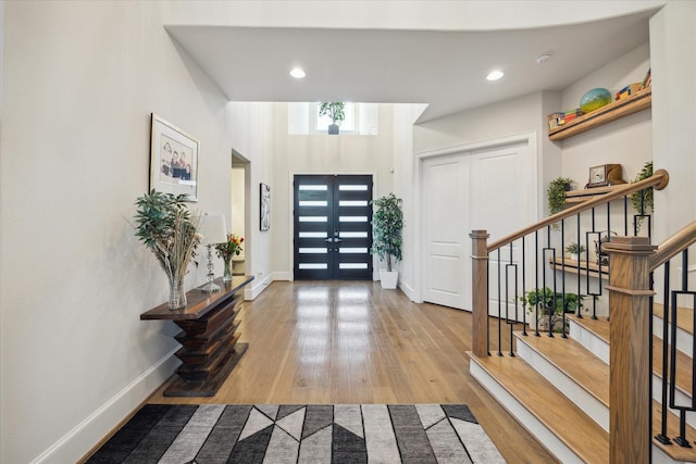 4019 Drummond St, Houston, TX 77025 - foyer with wood finished floors, stairs, recessed lighting, and baseboards