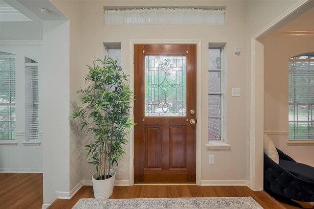 11943 Natural Bridges Ln, Sugar Land, TX 77498 - entrance foyer with wood finished floors and baseboards