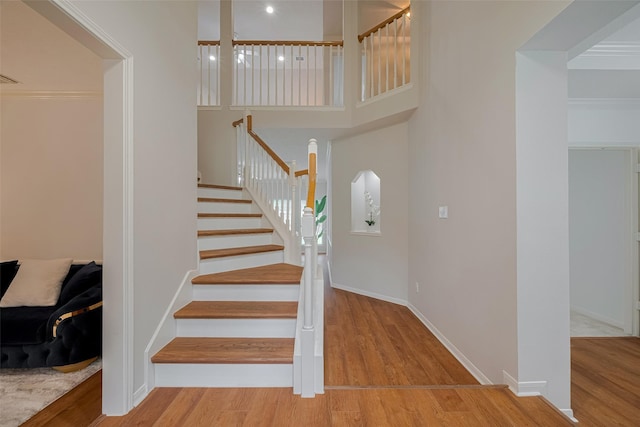 11943 Natural Bridges Ln, Sugar Land, TX 77498 - stairs featuring wood finished floors and baseboards