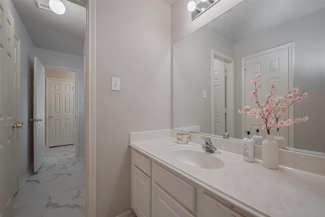 11943 Natural Bridges Ln, Sugar Land, TX 77498 - bathroom featuring marble look tile flooring, vanity, and baseboards