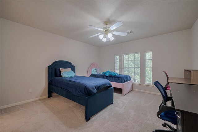 11943 Natural Bridges Ln, Sugar Land, TX 77498 - bedroom featuring an office area, light colored carpet, and baseboards