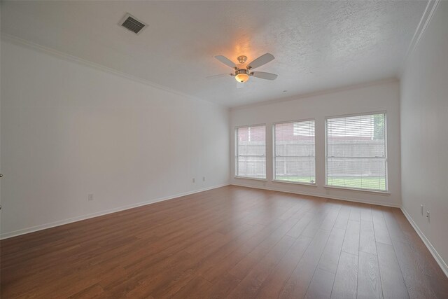 11943 Natural Bridges Ln, Sugar Land, TX 77498 - empty room with a ceiling fan, dark wood-type flooring, crown molding, baseboards, and a textured ceiling