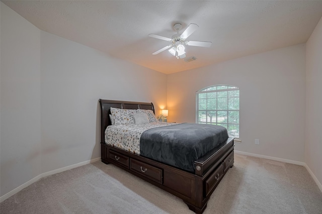11943 Natural Bridges Ln, Sugar Land, TX 77498 - bedroom featuring light carpet, baseboards, and ceiling fan