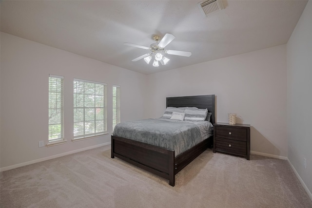 11943 Natural Bridges Ln, Sugar Land, TX 77498 - bedroom featuring light colored carpet, baseboards, and ceiling fan