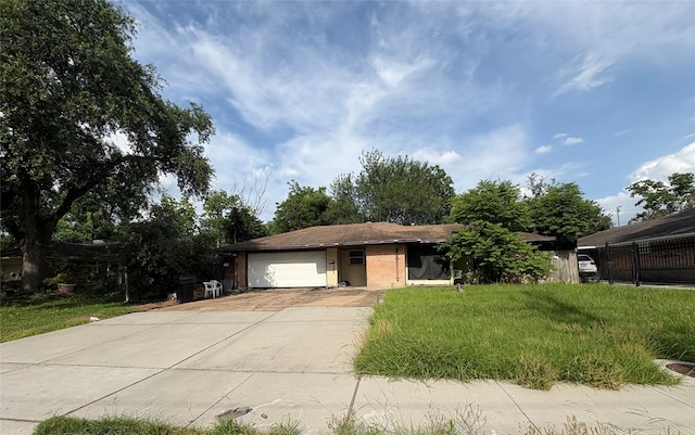 7513 Albacore Dr, Houston, TX 77074 - single story home with an attached garage, driveway, brick siding, and a front yard