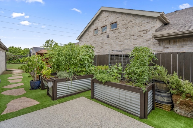 2715 Merlin Way, Katy, TX 77493 - view of patio with a garden