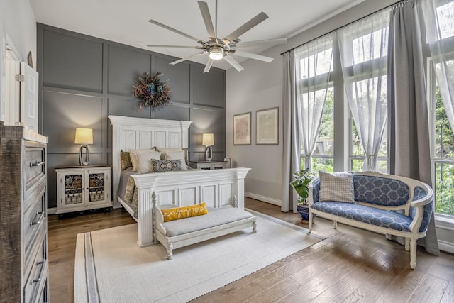 2715 Merlin Way, Katy, TX 77493 - bedroom with a decorative wall, wood finished floors, high vaulted ceiling, ceiling fan, and baseboards