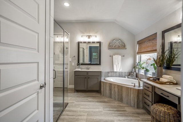 2715 Merlin Way, Katy, TX 77493 - full bathroom featuring a shower stall, a bath, vanity, lofted ceiling, and recessed lighting