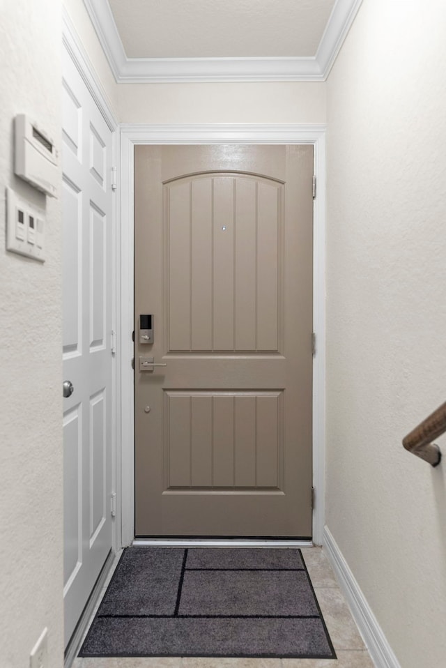 10822 Brittmoore Oaks Pl, Houston, TX 77043 - doorway with ornamental molding and baseboards