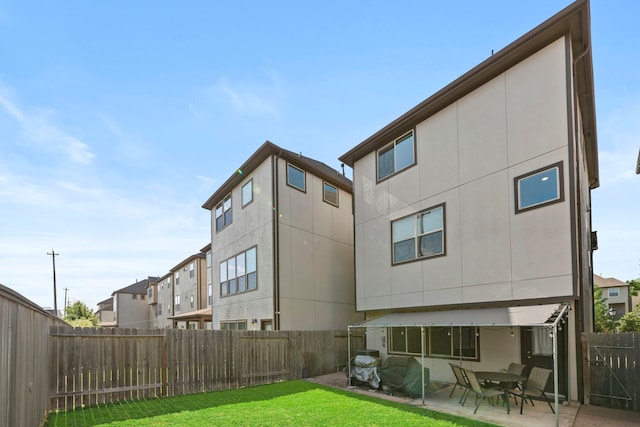 10822 Brittmoore Oaks Pl, Houston, TX 77043 - rear view of property featuring a patio