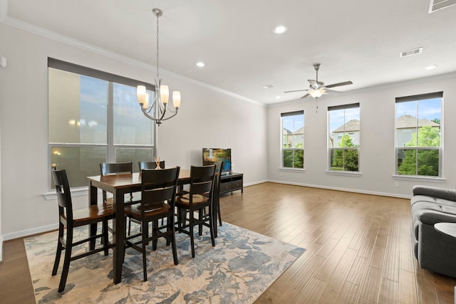 10822 Brittmoore Oaks Pl, Houston, TX 77043 - dining space with plenty of natural light, wood finished floors, ornamental molding, recessed lighting, and baseboards