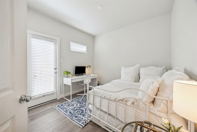 809 Burton Landing Ln, Houston, TX 77008 - bedroom featuring wood finished floors and a desk