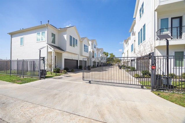 809 Burton Landing Ln, Houston, TX 77008 - view of concrete surface with a residential view, a gated entry, and a gate