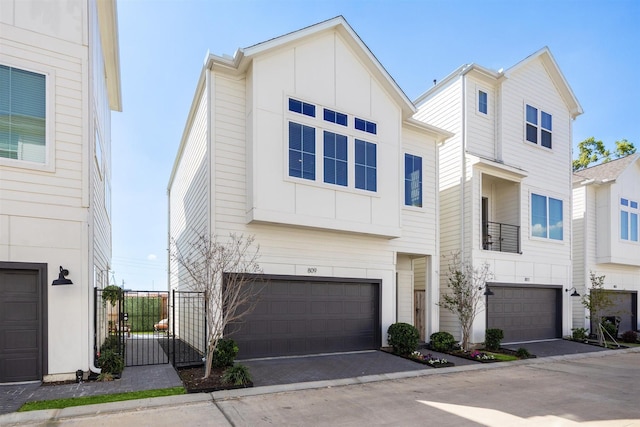 809 Burton Landing Ln, Houston, TX 77008 - view of front of house with a garage, board and batten siding, and a gate
