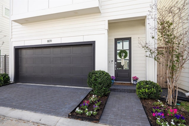 809 Burton Landing Ln, Houston, TX 77008 - view of exterior entry with decorative driveway and an attached garage