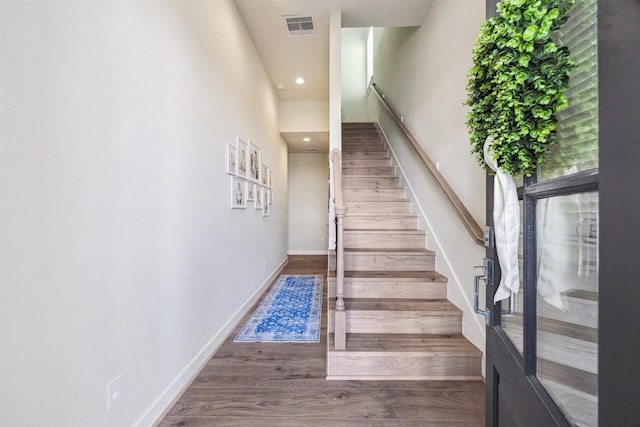 809 Burton Landing Ln, Houston, TX 77008 - staircase with wood finished floors, baseboards, and recessed lighting