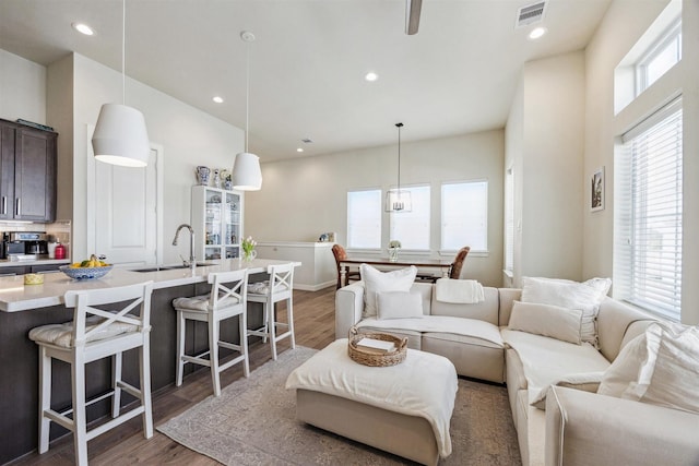 809 Burton Landing Ln, Houston, TX 77008 - living room featuring wood finished floors and recessed lighting