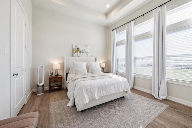 809 Burton Landing Ln, Houston, TX 77008 - bedroom featuring baseboards, wood finished floors, and multiple windows