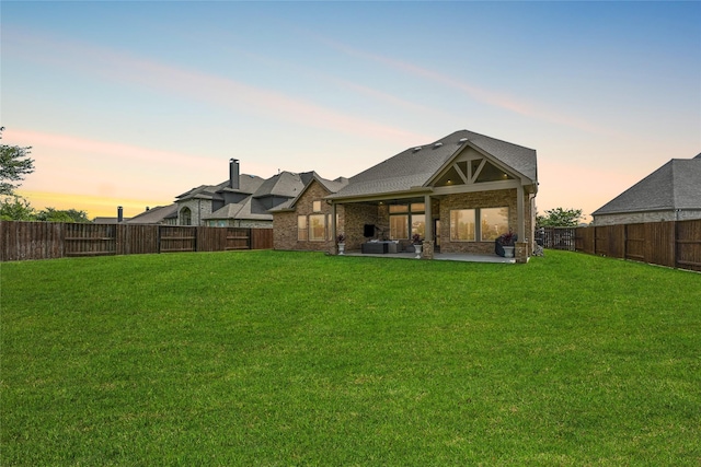 2603 Open Prairie Ln, Katy, TX 77493 - back of house at dusk featuring a patio and a fenced backyard