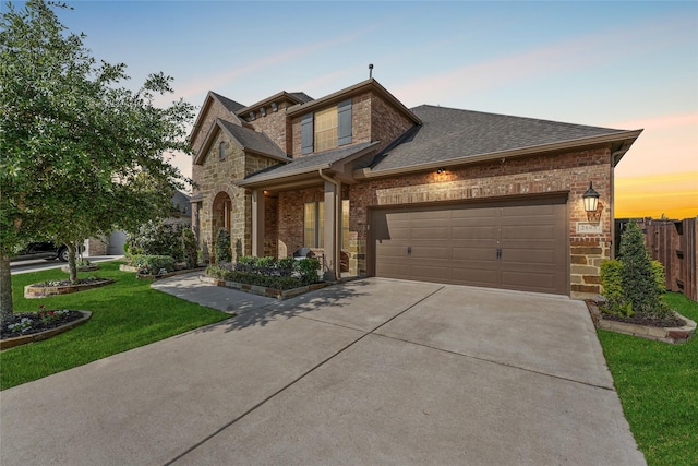 2603 Open Prairie Ln, Katy, TX 77493 - view of front of home featuring concrete driveway, roof with shingles, a garage, and stone siding