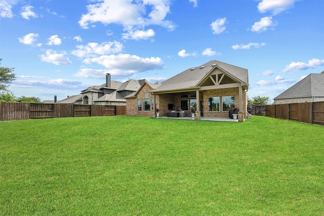 2603 Open Prairie Ln, Katy, TX 77493 - rear view of property with a patio, a fenced backyard, and brick siding
