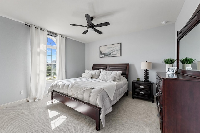 2603 Open Prairie Ln, Katy, TX 77493 - bedroom with light carpet, baseboards, and ceiling fan