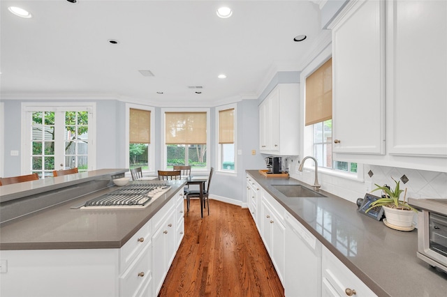 3509 Gramercy St, Houston, TX 77025 - kitchen featuring a sink, white appliances, dark countertops, crown molding, and dark wood-style floors