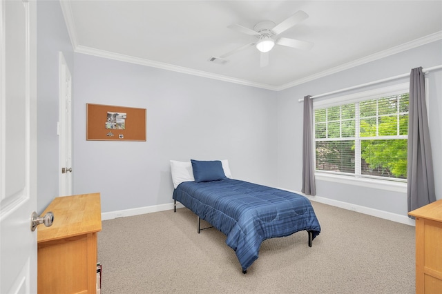 3509 Gramercy St, Houston, TX 77025 - bedroom with ornamental molding, light carpet, baseboards, and a ceiling fan