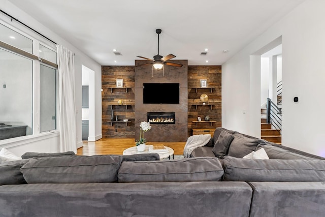 815 E 27th St, Houston, TX 77009 - living area with a ceiling fan, wood finished floors, stairs, recessed lighting, and a lit fireplace