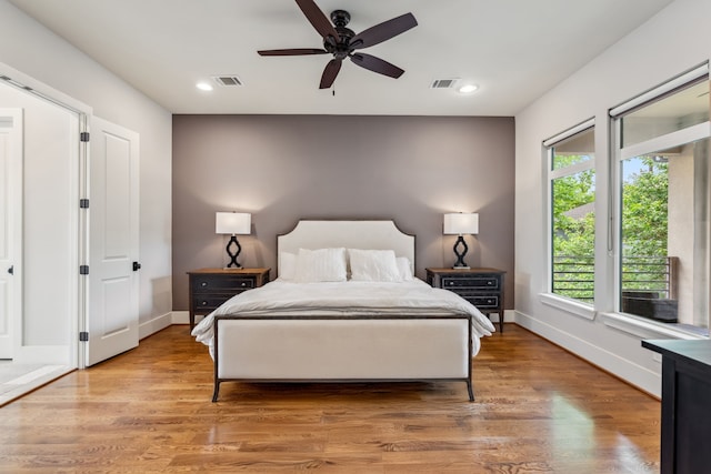 815 E 27th St, Houston, TX 77009 - bedroom featuring baseboards, recessed lighting, light wood-style flooring, access to exterior, and ceiling fan