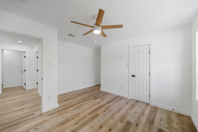 3906 Simsbrook Dr, Houston, TX 77045 - spare room with attic access, a ceiling fan, and light wood-style floors