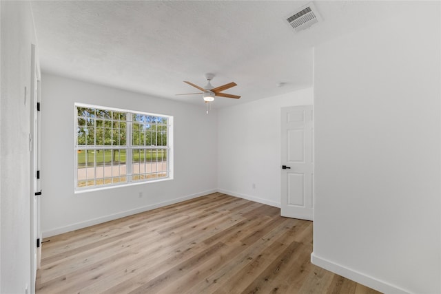 3906 Simsbrook Dr, Houston, TX 77045 - spare room featuring ceiling fan and light wood-style flooring