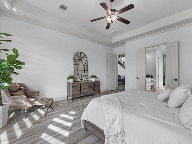 19003 Cove Manor Dr, Cypress, TX 77433 - bedroom with light wood finished floors and ceiling fan
