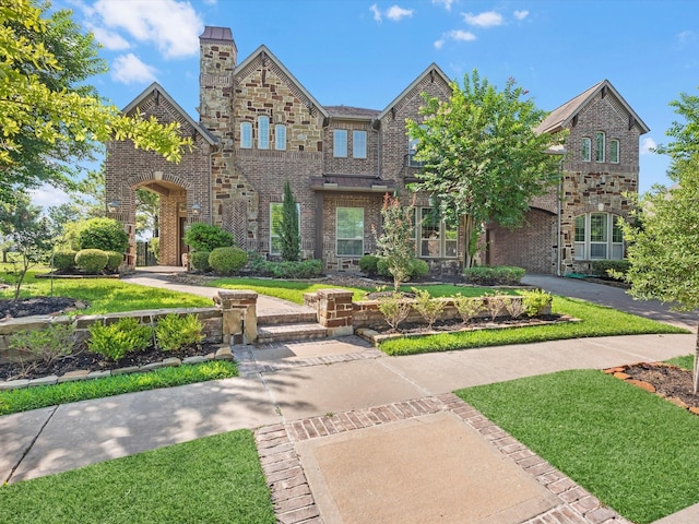 19003 Cove Manor Dr, Cypress, TX 77433 - view of front of house with a front lawn and brick siding
