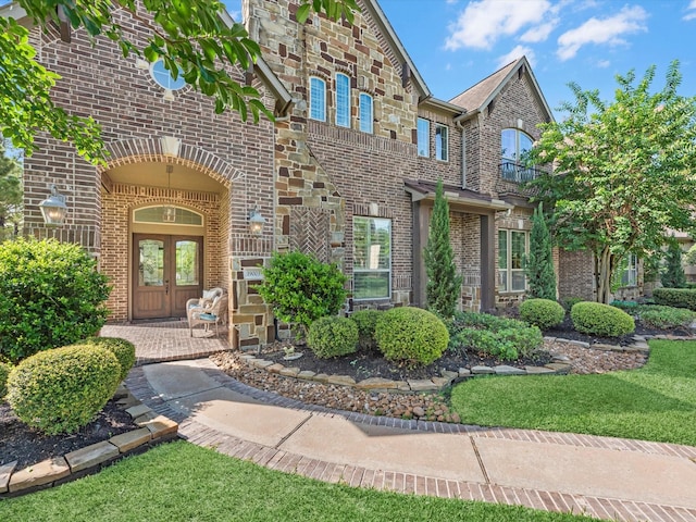 19003 Cove Manor Dr, Cypress, TX 77433 - entrance to property featuring brick siding, french doors, and stone siding