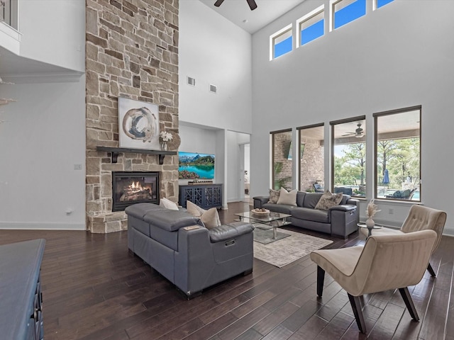 19003 Cove Manor Dr, Cypress, TX 77433 - living room featuring ceiling fan, dark wood-style flooring, baseboards, and a towering ceiling