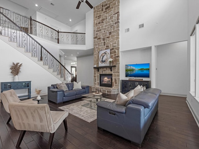 19003 Cove Manor Dr, Cypress, TX 77433 - living area with a towering ceiling, hardwood / wood-style flooring, a stone fireplace, stairs, and ceiling fan