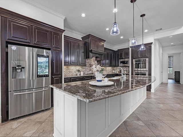 19003 Cove Manor Dr, Cypress, TX 77433 - kitchen with stainless steel appliances, tasteful backsplash, dark stone countertops, crown molding, and recessed lighting