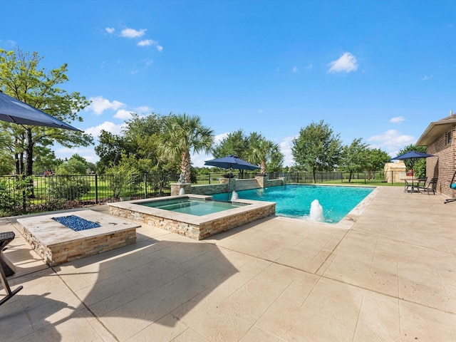 19003 Cove Manor Dr, Cypress, TX 77433 - view of swimming pool with a patio, a fenced backyard, and a pool with connected hot tub