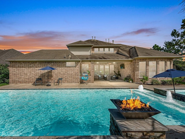 19003 Cove Manor Dr, Cypress, TX 77433 - view of pool featuring a patio area, an outdoor fire pit, and a pool with connected hot tub