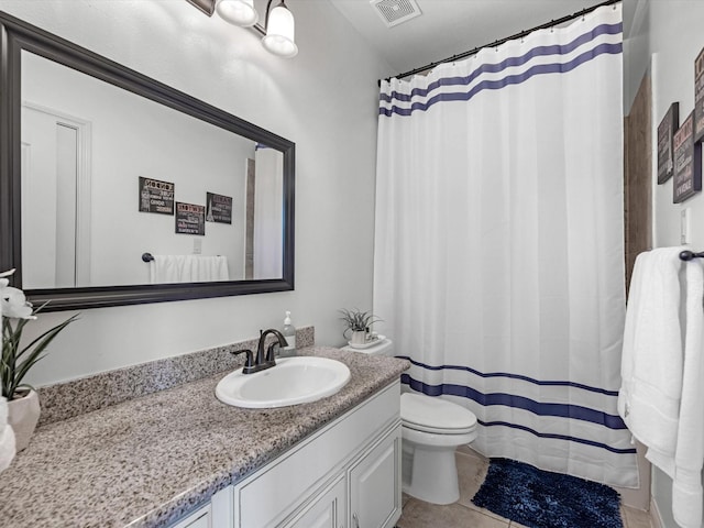 19003 Cove Manor Dr, Cypress, TX 77433 - bathroom featuring toilet, vanity, tile patterned floors, and curtained shower