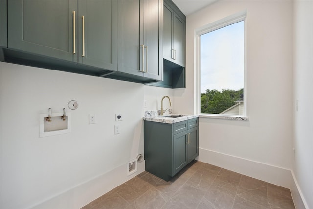 806 Holton St, Bellaire, TX 77401 - washroom with electric dryer hookup, hookup for a gas dryer, hookup for a washing machine, cabinet space, and baseboards
