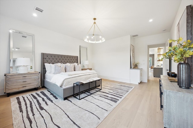 806 Holton St, Bellaire, TX 77401 - bedroom featuring light wood-style floors, a chandelier, and recessed lighting